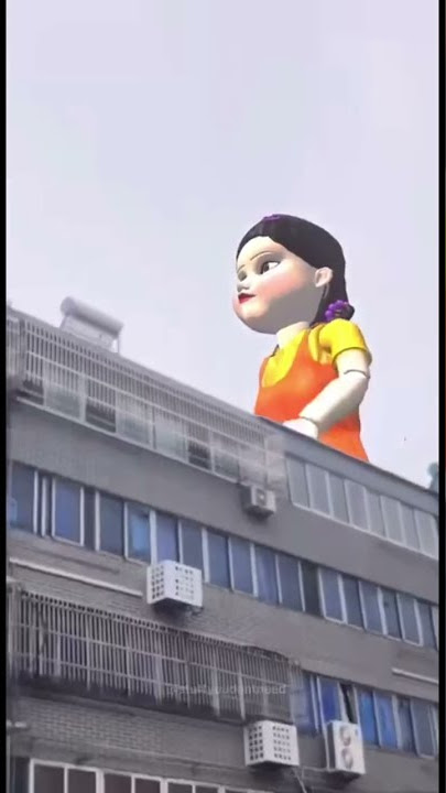 GIANT DOLL KOKOLA SQUID GAME WALKS AROUND IN THE CITY