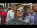 People crowd Tehran exchanges as Iran's rial rallies after weeks of falls