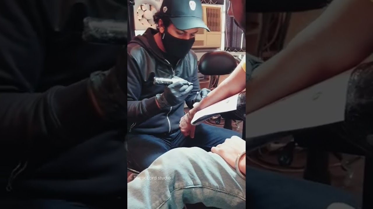 lord Krishna flute with peacock feather tattoo design