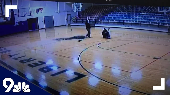 WOW! Custodian makes half-court shot with back tur...