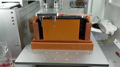 Instant adhesive glue dispensing machine with pick up arm
