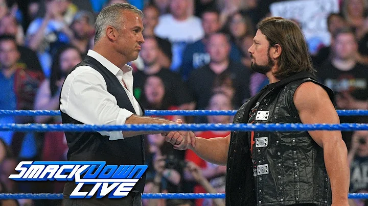 Shane McMahon & AJ Styles shake hands before the "...