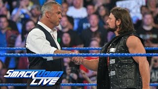 Shane McMahon & AJ Styles shake hands before the 