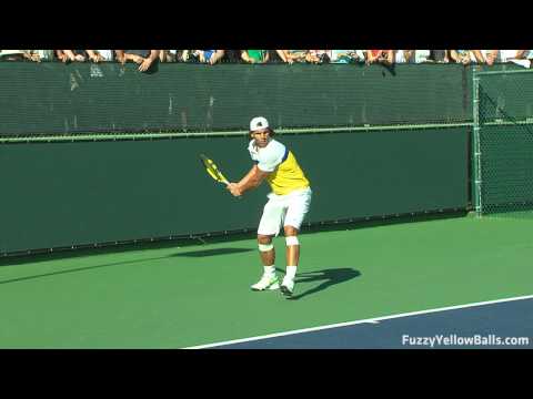 www.fuzzyyellowballs.com Rafael Nadal hitting backhands in high definition from the three-quarters perspective. This video was filmed at the BNP Paribas Open in Indian Wells, CA ( www.bnpparibasopen.org ). To learn how to hit backhands like Nadal and for more HD video, please visit http !