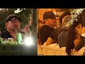 Leonardo DiCaprio is surrounded by models during late night dinner in Paris