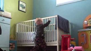 Cale climbing out of crib