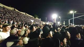 10's of thousands of hasidic Jews jumping with joy, lag b'oimer meron