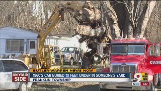 1960s convertible buried in Franklin Township property's front yard