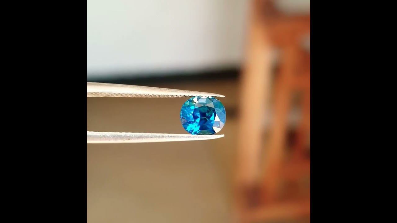 Teal sapphire heated 1.55 loupe clean very good luster glass body transparent