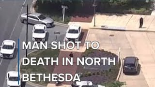 Man shot to death in hotel parking lot