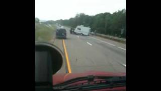 SUV pulling camper rolled over