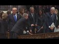 George w bush hands candy to michelle obama ahead of his fathers funeral