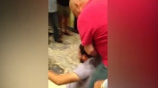 Trump Supporter Drags Latino Protestor Out Of Rally