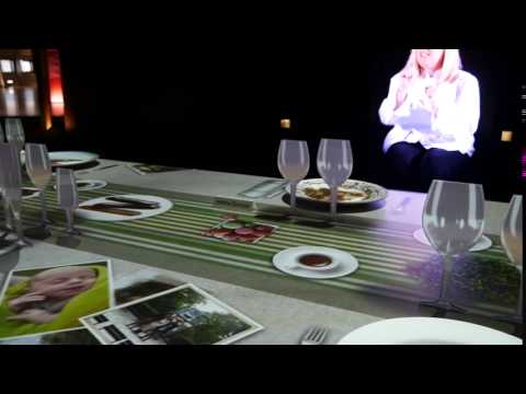 Projection on a dining table synced with vertical screens in La Cité du Vin in Bordeaux