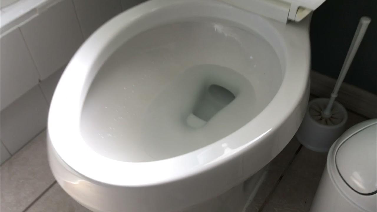 Flushing a Kohler Highline toilet. YouTube