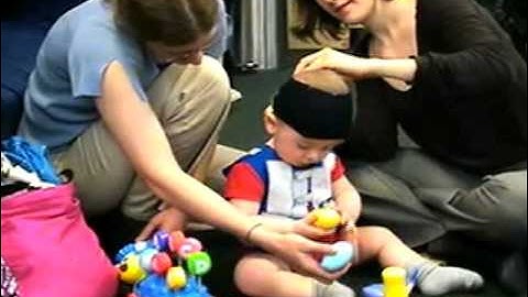 NYU Infant Action Lab - Placing eye tracking equipment on an infant