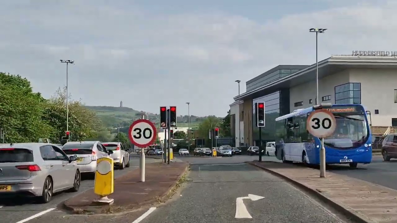 RIDING THROUGH HUDDERSFIELD, SATURDAY, 4 P. M.