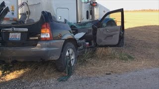 One extricated from SUV after accident with semi