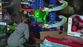 Little boy who lost his parents to COVID-19 giving away donated toys to kids in need