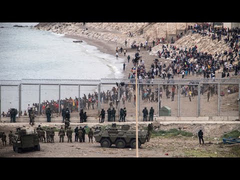 Ceuta: Children among thousands of migrants in desperate swim from Morocco to Spanish enclave