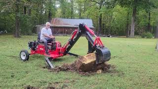 Harbor Freight backhoe digs another rock from the lawn