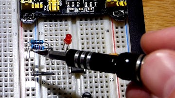 LM393 comparator IC non inverting basic LED on off circuit controlled by trimpot voltage divider