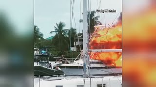 WATCH : Unconscious man saved from boat fire in Florida by two police officers