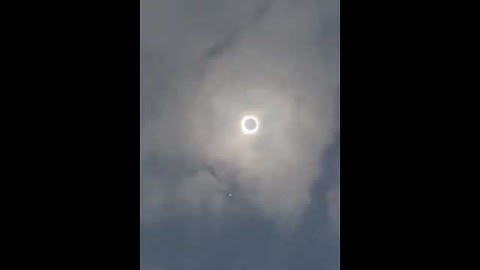 The solar eclipse over the clouds