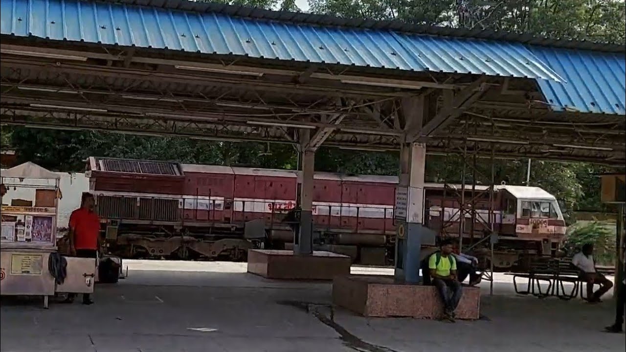 RED EMD WDG4 OF LUDHIANA STANDING ALONE AT FIROZPUR CANTT WITH GREEN WDG4 OF INDIAN RAILWAYS