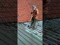 The process of painting a roof using a powerful sprayer