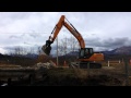 KIDS!  A Digger moving Big Rocks!