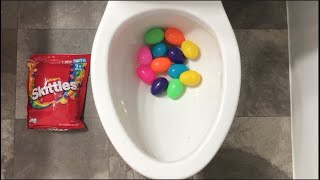 Will it Flush? - Rainbow Surprise Eggs and Skittles Candy