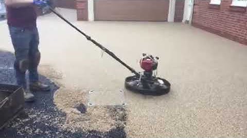 SureSet hover float machine being demonstrated for permeable resin bound paving installations