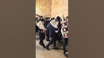 Jews celebrate the Simchat Torah holiday at the Western Wall in Jerusalem, Israel, in 2025