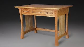 The desk is made from Cherry and accented with spalted maple for the side panels and handles. The handles are held in place with 