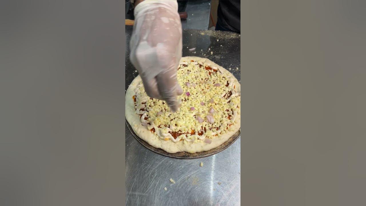 Paneer Pizza Cafe Art Jagat Puri Delhi pizza shorts (Location in