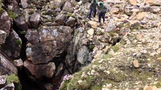 Throwing rock down a blow hole