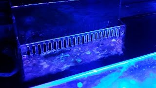 built in overflow vs. hang on the back overflow