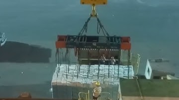 Export from Russia. Loading of a cargo ship at the seaport. Marine logistics.