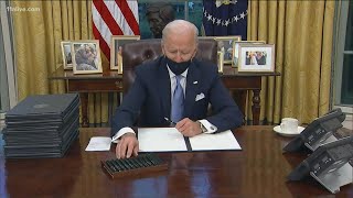 President Joe Biden signs his first executive orders