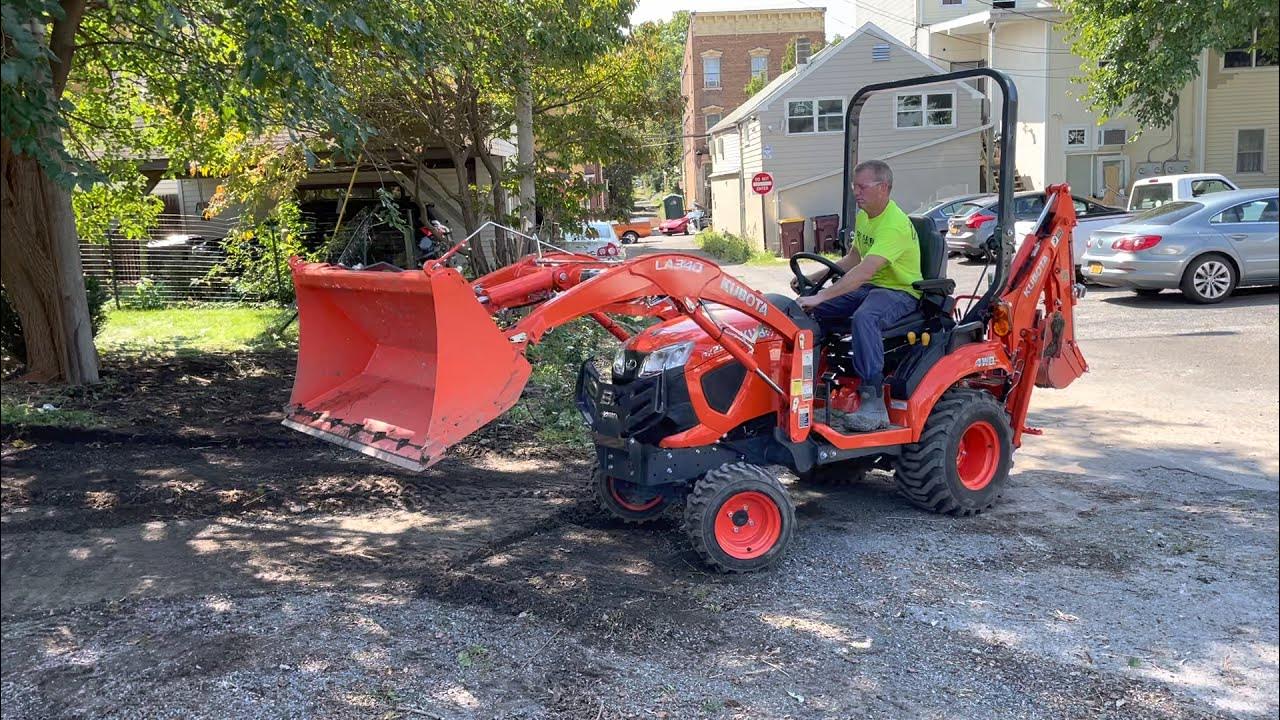 Kubota BX23S digging out Blacktop and Gravel driveway YouTube
