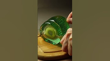 Kiwi Cut - Highly realistic ultra 8K ASMR video of a human hand slicing a hyper-detailed