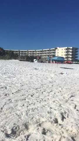 Man Uses Umbrella to Hit Man With Gun at Beach