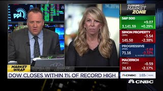 Dow closes within 1% of record high
