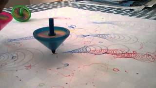 Spinning tops draw patterns like Spirograph