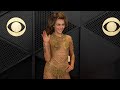 GRAMMYs: Miley Cyrus Rocks See-Through Gold Gown