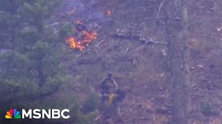 'Absolutely devastating': Two dead, thousands flee New Mexico wildfires 