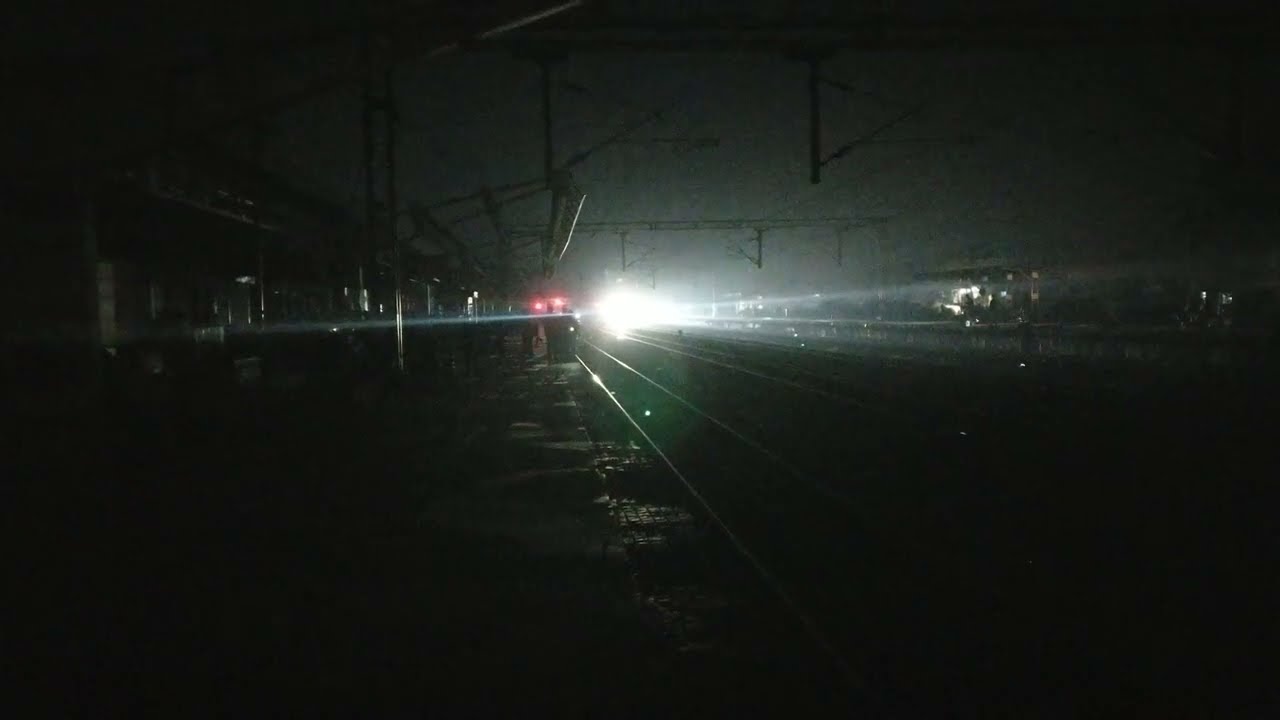 No lights on Railway station and DMU Train arriving in the light of the Train 