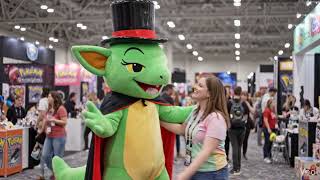 Green Alien With Top Hat And Cape Hugging A Fan