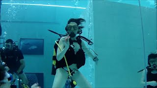 Group Of Female Scuba Divers Practice In Pool